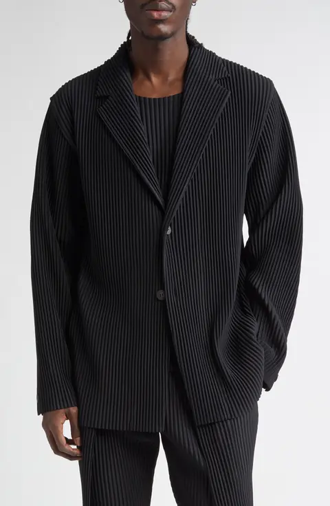 Issey Miyake’s structural signature lay in designing generative systems, namely pleats, folds, cuts, and movement, from which garments could take form.